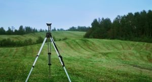 GNSS system on a tripod in a field