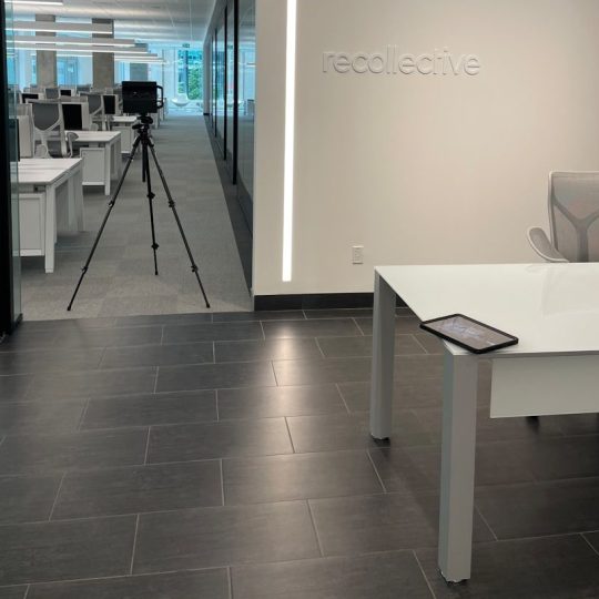 a room with a desk and a camera in it